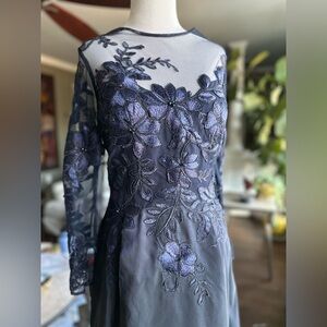 Formal illusion neckline gown in navy blue